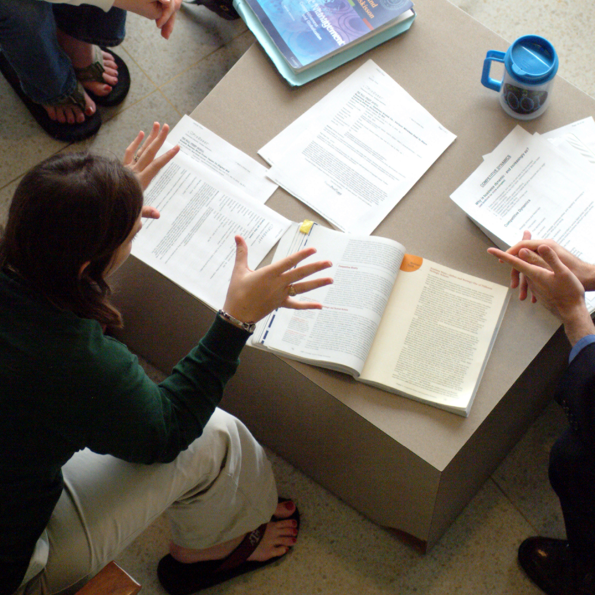 students discussing textbooks